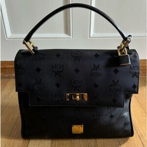 Black MCM Visetos Top-Handle Bag (comes with shoulder strap)
